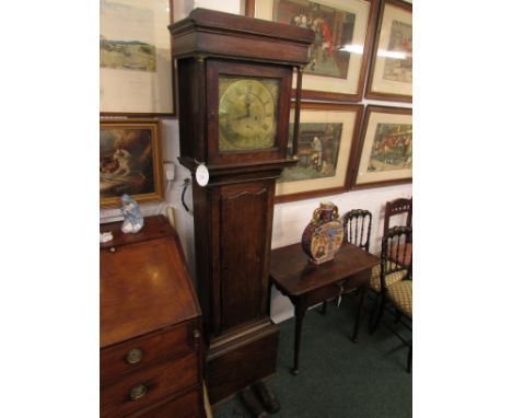 An early 19th century oak cased eight-day striking grandfather clock standing 200 cm high. The square hood has two reeded col