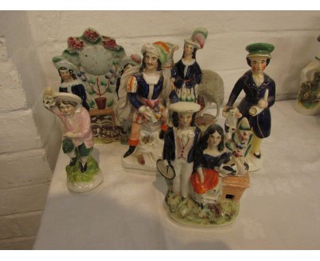 Six 19th century Staffordshire flatback pottery figures - boy with dog, children with hoop and rabbit, lady with sheep, boy i