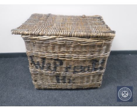 A large vintage wicker laundry hamper 