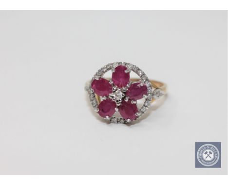 A 9ct gold ruby and diamond ring, size P