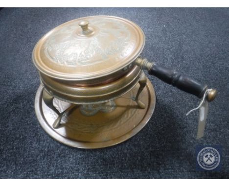 An antique hand hammered copper lidded pot on stand with burner, lidded pan together with a similar tray 