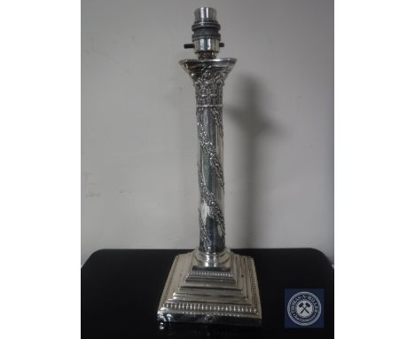 A silver plated Corinthian column lamp base