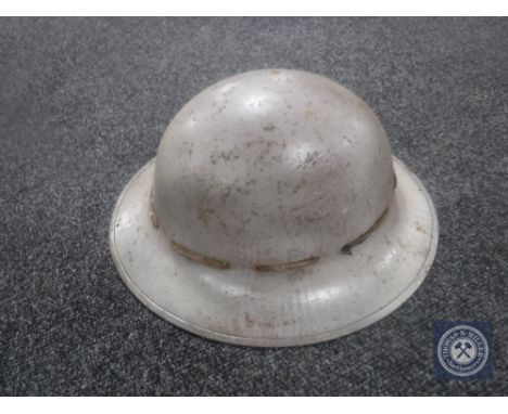 A WWII British tin helmet 