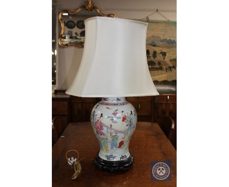 A Chinese porcelain table lamp on carved hardwood circular base CONDITION REPORT: Vase and wooden base height is 41cm. Overal