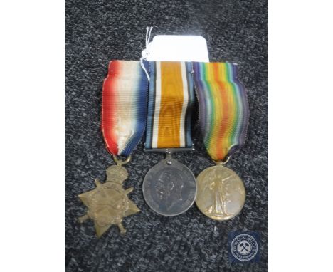 A WWI medal trio with ribbon on bar awarded to T4-128055 DVR J R Rooke A.S.C