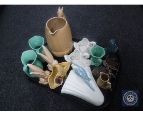 A tray of eleven pieces of Sylvac china, Squirrel jug, wall pocket, rabbit figure, Poole otter and Wade tortoise 