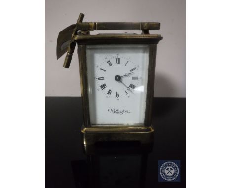 A brass cased Wellington carriage clock with key