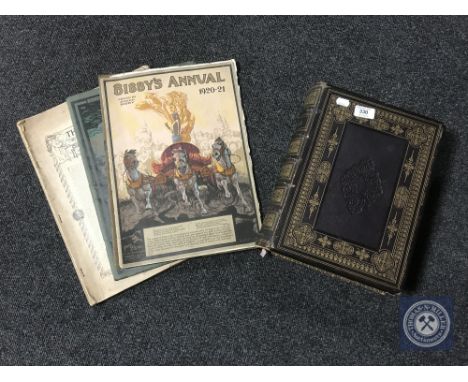 A mid 19th century leather bound family bible together with three Bibbys annuals 1912, 1913 and 1920/21 and one further volum