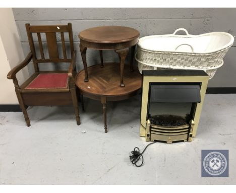 An oak commode armchair, mahogany coffee table, wicker Moses basket and a coal effect electric fire 