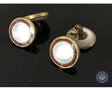 A pair of gold and mother of pearl cufflinks, stamped 18ct.