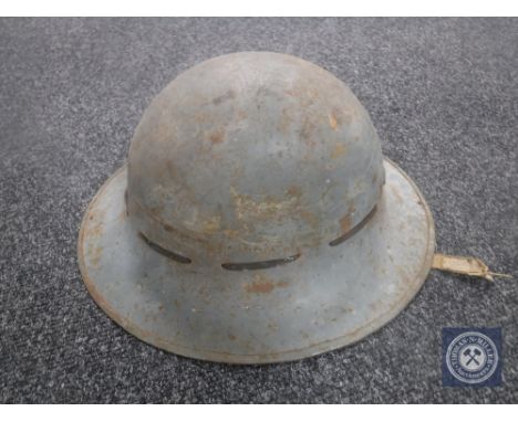 A WWII British tin helmet 