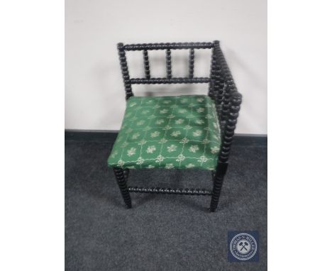 A Victorian ebonised bobbin corner chair 