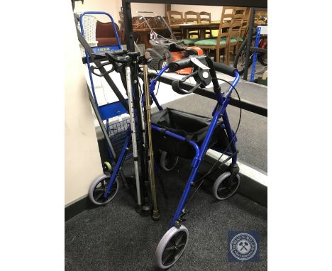A disability walking aid, five walking sticks, set of Halfords car roof bars and a folding light weight sack barrow 