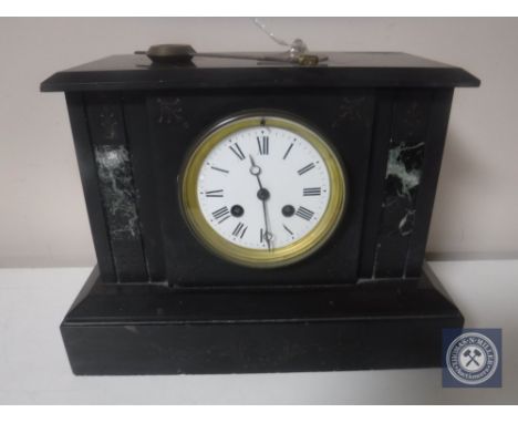 A Victorian slate and marble mantel clock with enamel dial, with pendulum and key