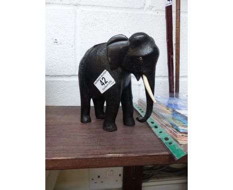 Ebony elephant with ivory tusk