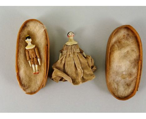 Two miniature painted wooden Grodnertal dolls, German circa 1820, each with finely painted features, painted black hair and o