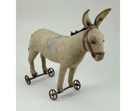 Early Steiff felt Donkey on wheels, German circa 1906, the grey felt Donkey with black boot button eyes, printed nose and mou
