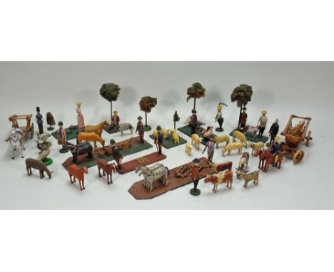Large scale Erzgebirge farm, countryside figures and animals, 1870s, well carved and painted figures including seven scenes m