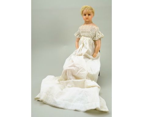 Poured wax Pierotti shoulder head baby doll, English circa 1860, the slightly turned head with blue glass eyes with moulded l