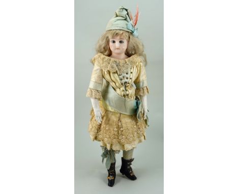 Wax over composition shoulder head doll, German circa 1860, the slightly turned head with weighted brown glass eyes, painted 
