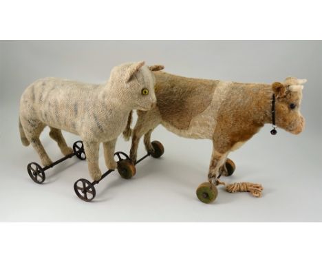 Early Steiff burlap plush Cat on wheels, German circa 1910, cream with grey striped Tabby cat with yellow and black glass eye
