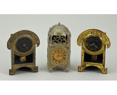 Three miniature clocks for dolls house, German circa 1890, including a pair of gilt metal mantle clocks in the Art Nouveau st