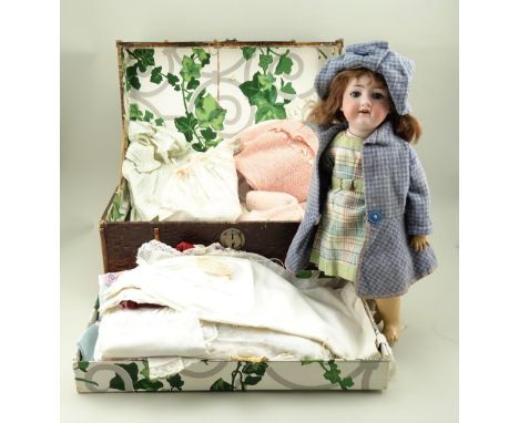 A.M 390 bisque head doll, German circa 1910, with weighted blue glass eyes, open mouth, upper teeth and original brown hair, 