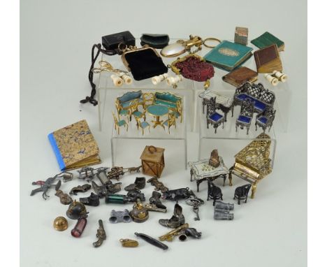 Collection of miniature Dolls accessories, including a French gilt metal and mother of pearl perfume bottle, five books, thre