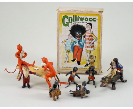 Lead Devils playing cards, Golly and Peg Dolls, red painted Devils seated on a bench, (condition: some paint loss to bench), 