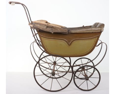 A Victorian child’s Dolls pram, 1890s, painted light and dark green pram with red lining, padded leatherette interior, foldin