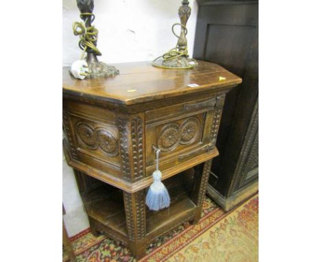 JACOBEAN DESIGN OAK CUPBOARD, carved oak cabinet with wrought iron hinges and open shelf base, 31" width 