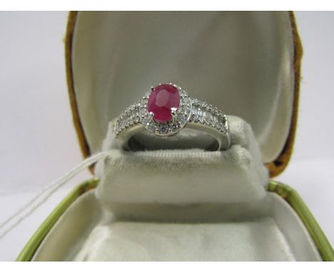 PLATINUM RUBY &amp; DIAMOND RING, by Rhapsody, principle oval cut Burmese ruby of approximately 0.75ct surrounded by a halo o