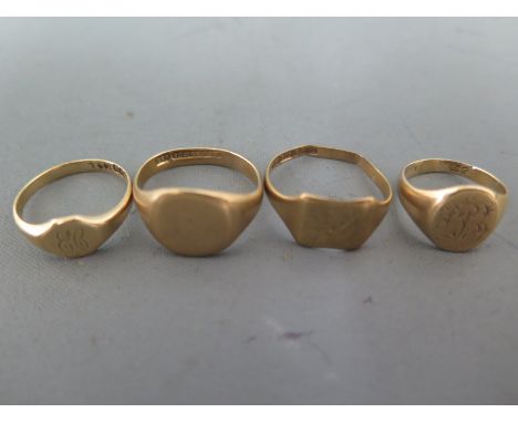 Four 9ct yellow gold signet rings sizes R, U, J & O - approx weight 13 grams - two with deformation