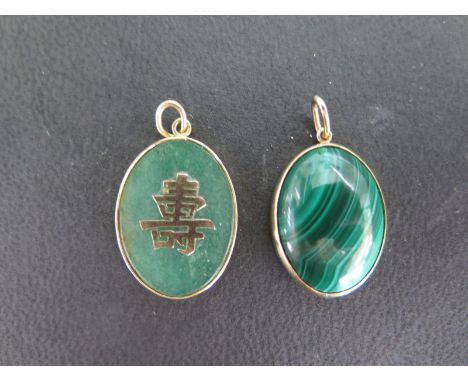 A Malachite and 9ct pendant - Height 22mm and a 9ct gold and jade pendant Condition report: Both in good condition 