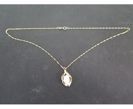 An 18ct yellow gold opal and diamond pendant on an 18ct yellow gold chain - chain length 39cm - Weight approx 3.2gms Conditio