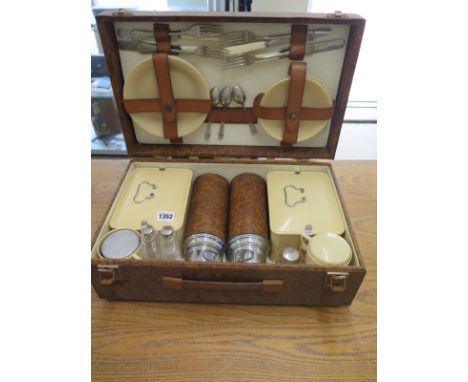 A vintage four person picnic hamper
