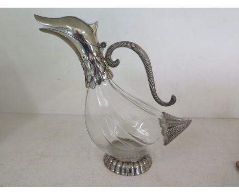 A white metal and glass decanter in the form of a duck - in good condition