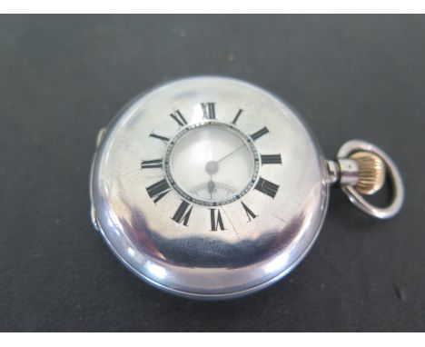 A .935 silver Hunter pocket watch with Roman numerals to white enamel dial, subsidiary seconds at 6 o'clock - face loose but 