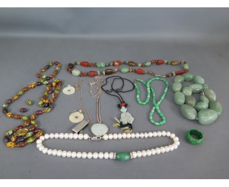 A collection of jade, jadeite or nephrite jewellery - some with silver mounts etc and a string of freshwater pearls and loose