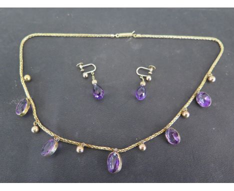 A 9ct yellow gold and five stone amethyst necklace - Length 42cm and a pair of 9ct gold amethyst earrings - Total weight appr