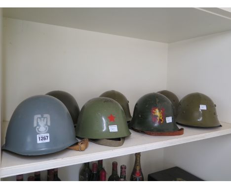 Two Polish M75 helmets post 1975 one with Army Eagle the second Air Force and Yugoslavian M59 helmet with Communist Red Star 