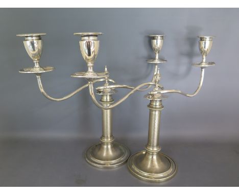 A pair of silver plated two sconce candelabra on circular base Condition report: Both are in good condition clean and bright 