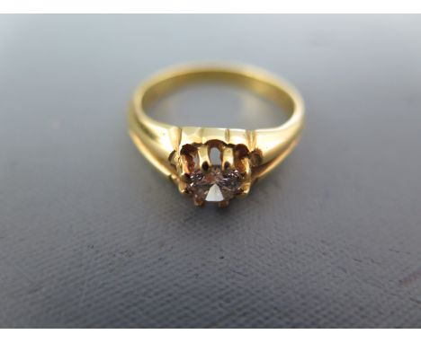 An 18ct yellow gold solitaire ring size Q - approx weight 5.8 grams - very minor usage wear, diamond has some very small incl