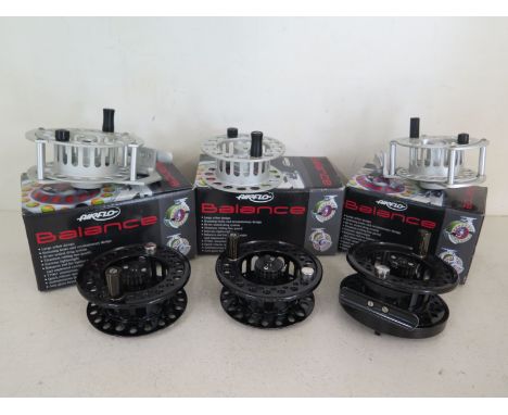 Three fly reels, two boxed unused airflo balance fly reels, a model 7/9 with boxed spare spool and a model 3/ - both new old 