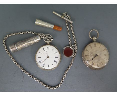 Two silver cased open faced pocket watches, one with white enamel dial and Roman numerals, one with silvered dial and Roman n