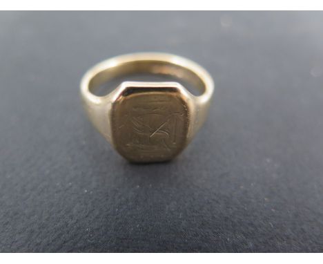 A 9ct yellow gold signet ring size P - approx weight 5.3 grams - some usage wear, engraved