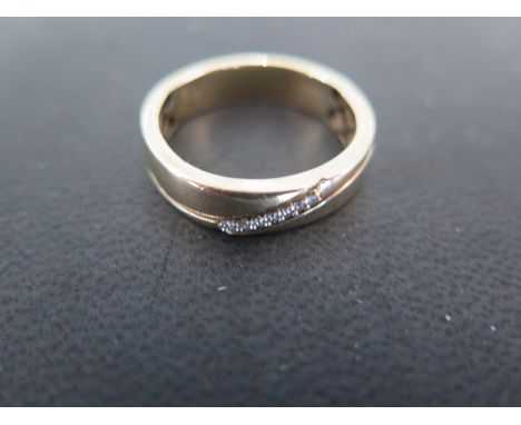 A 9ct yellow gold and diamond band ring - size S - Weight approx. 4.5gms 