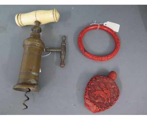 A late Georgian/Victorian bell metal and steel retractable corkscrew with brush missing otherwise good order - and a Cinibar 