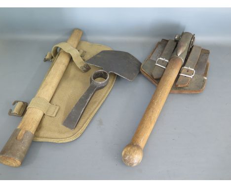 A West German Entrenching tool dated 1965 and a two part Pick Axe in canvas bag and an aluminium water bottle Condition repor