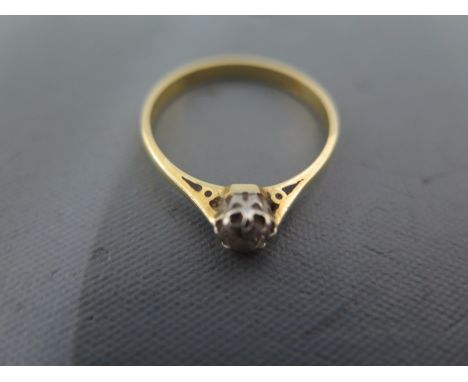 An 18ct yellow gold solitaire ring size P - approx weight 2.2 grams - good condition, some usage wear